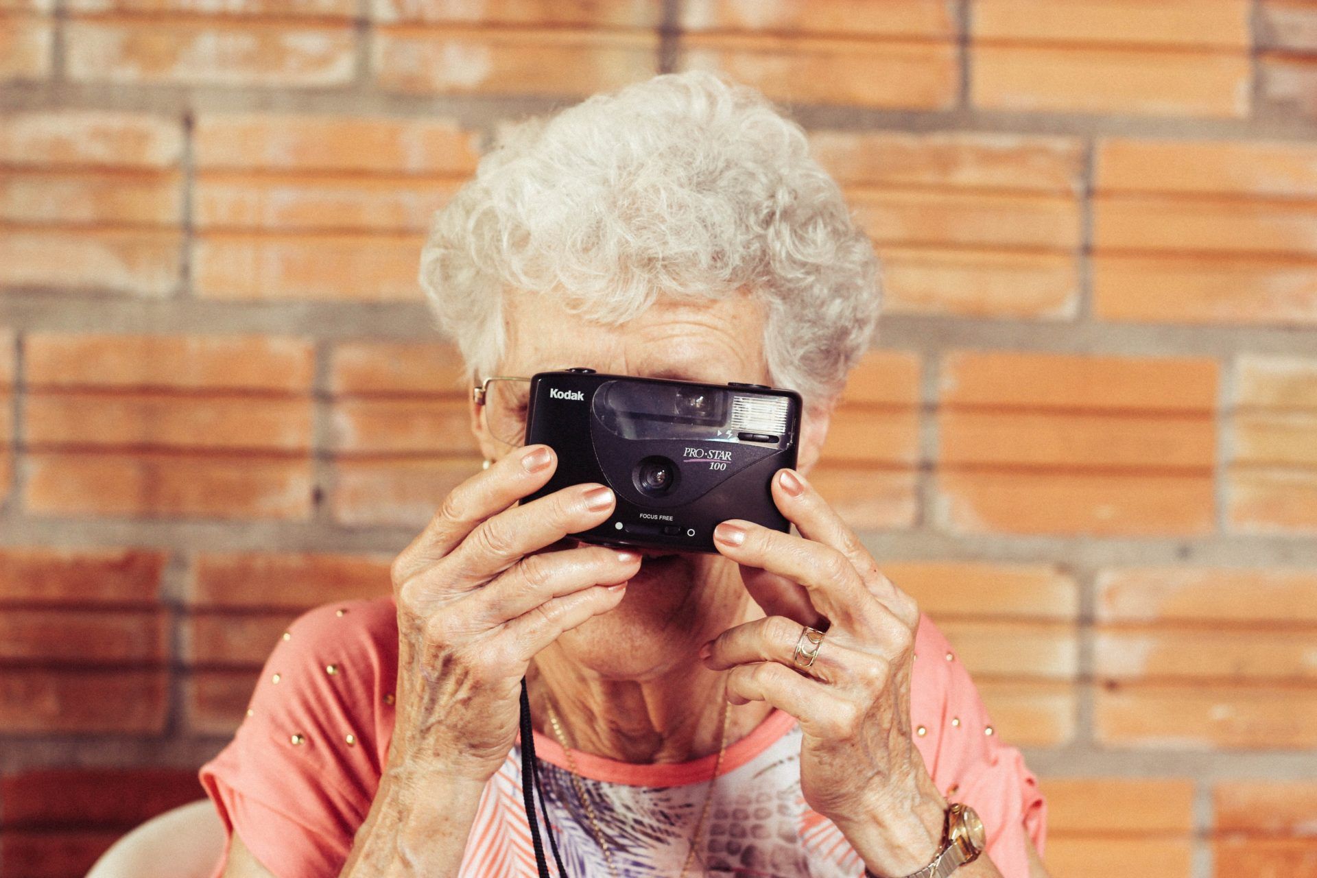 Retired lady taking a photo