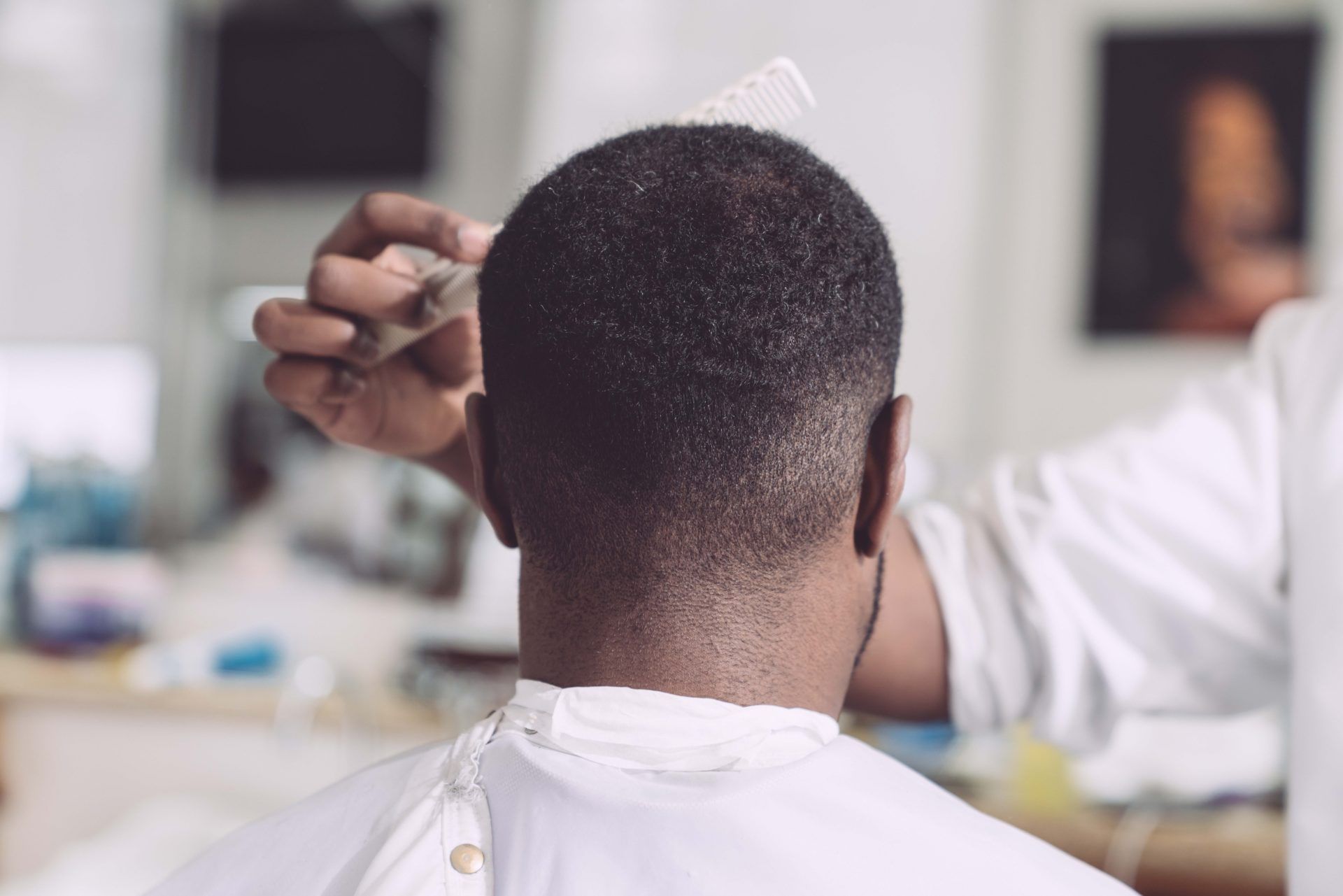 Barber cutting hair